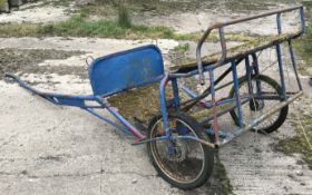 A small two wheeled pony cart.