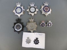 A collection of police badges including Port of London,