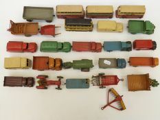 Twenty five Dinky Toys diecast model commercial and agricultural vehicles including buses, tractors,