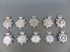 Ten police helmet badges including York North and East Yorkshire, Cambridgeshire Constabulary,