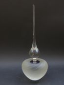 A studio glass scent bottle with spiral pattern and elongated stopper,