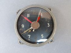 A WWII cockpit clock with time of trip type red hands to glass marked 6A/1002 and stamped 17461/44