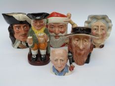 A collection of character jugs including Royal Doulton Santa Claus and d'Artagnan