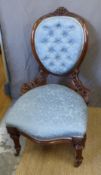 A Victorian upholstered carved mahogany nursing chair