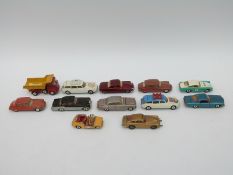 Twelve Corgi Toys diecast model vehicles including James Bond Aston Martin, Winter Olympics cars,