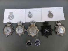 A collection of police badges including Warrington Borough, Huddersfield, South Shields,