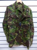 A large quantity of army uniform relating to the Iraq war to include helmet, boots,