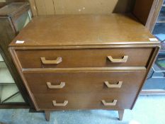 A G Plan chest of three drawers with the top drawer opening to reveal a lift up mirror and fitted