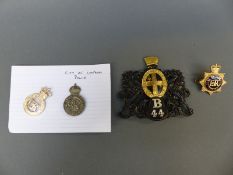 A collection of police badges relating to City of London Police and a rare B44 district badge