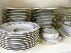 An extensive Limoges dinner service including 33 dinner plates,