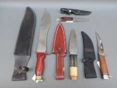 Four sheath knives including Damascus bladed example,