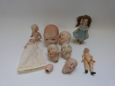 Ten bisque miniature dolls and dolls' heads, some marked,