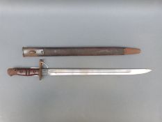A WWI US M1917 bayonet with leather scabbard