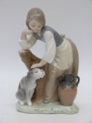 Lladro figurine of a girl petting her dog