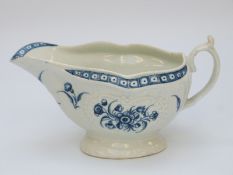 A first period Worcester pedestal sauce boat with marks to base (length 17cm)