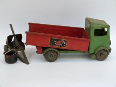 A Tri-ang pressed steel tipper lorry with green cab and red body and wheels,