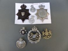 A collection of police badges including Portsmouth City Police, Plymouth,