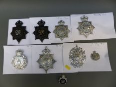 A collection of police badges including Oldham, Leeds City, Blackburn, York City,