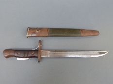 US Remington M1917 short bayonet marked 1913 9 17 to blade with green painted leather scabbard