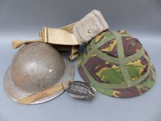 A practice hand grenade marked RBD together with two army helmets,