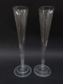 A pair of large glass trumpet vases,