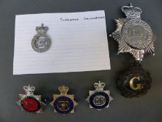 A collection of police badges relating to Gloucestershire Constabulary