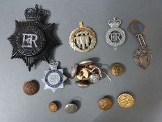 A quantity of police and military badges including Gloucestershire Constabulary,
