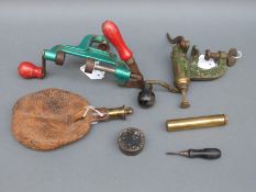 Two shotgun cartridge roll over tools, a brass oil bottle stamped EFD,