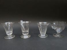Four 19thC glass custard cups, all with applied handles and cut decoration, largest 8.