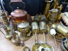 A large collection of brass and copper ware to include Welsh miner's lamp, kettle, meat jacks,