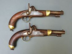 A pair of French 16 bore percussion hammer action service pistols with brass mounts,