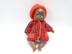 Armand Marseille black bisque headed doll with closed mouth, weighted brown eyes and jointed limbs,