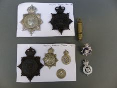 A collection of police badges relating to Reading Borough Police including a whistle