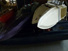 A large collection of remote control model boats.