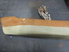 A part built wooden model boat