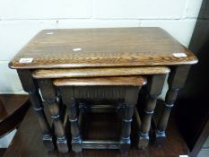 A nest of oak occasional tables