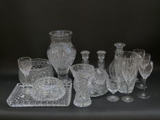 A collection of Waterford and Edinburgh Crystal and similar cut clear glassware including vases,