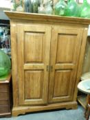 A pine wardrobe with hanging space and shelves (H184 x W142 x D60cm)