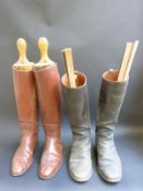 A pair of vintage leather riding boots with wooden trees, together with similar example,