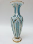 An overlaid and cut glass pedestal vase with gilt decoration,