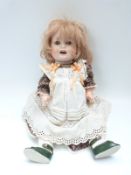 Ernst Heubach bisque headed doll with open mouth, weighted blue eyes,