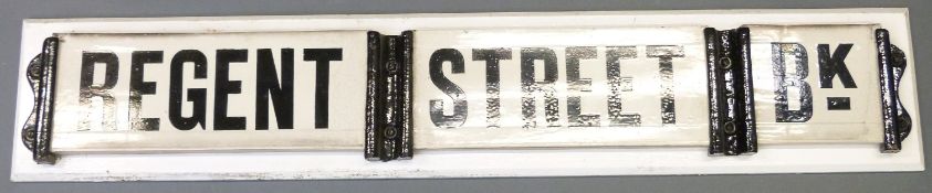 A vintage ceramic and cast iron Regent Street Bk road sign,