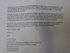 A pair of African ritual or ceremonial tongue and blade axes carved in the form of stylised ibex or