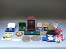 A mahogany-cased mantel clock fitted with a Jaguar dashboard clock, Jaguar desk knife,