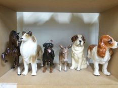 A collection of Beswick animals including donkey, horses,