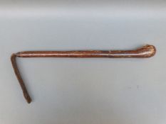 A leather cudgel or cosh with lead insert to end,