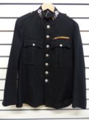 A vintage Berkshire Constabulary Police tunic with insignia,