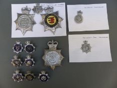 A collection of police badges including Avon and Somerset Constabulary, Somerset and Bath,