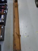 A 19th/20thC metal bound oak fishing rod box with leather straps,