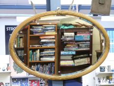 19th century gilt framed oval mirror with bevelled edge glass,